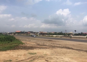 10,000 Sqmt Land. Fenced Round And Already Sandfilled With A Bungalow Used For Office And A Gate House Facing Lagos Ibadan Expressway Beside Compass Newspaper. 10,000 Meter Square of Land for Sale Ojodu Lagos Vetra  Property