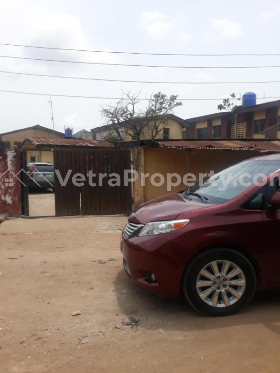  Standard full plot of land with demolishable bungalows in a serene and well secured environment close to Ago Expressway  Land for Sale  Lagos Vetra  Property