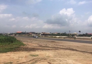 Special Sale: A 10,000 Sqmt Land. Fenced Round And Already Sandfilled With A Bungalow Used For Office And A Gate House Facing Lagos Ibadan Expressway  10,000 Meter Square of Land for Sale Ojodu Lagos Vetra  Property